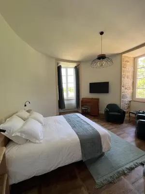 Un ou plusieurs lits dans un hébergement de l'établissement Château d'Aynac