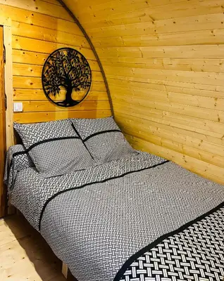 Un ou plusieurs lits dans un hébergement de l'établissement Aux Étangs de Jourgnac - Cabane MégaPod