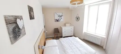 Un ou plusieurs lits dans un hébergement de l'établissement Les Chamois du Sancy