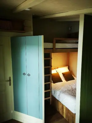 Un ou plusieurs lits dans un hébergement de l'établissement Les cabanes au bord du lac