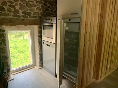 Cuisine ou kitchenette dans l'établissement La Grange de la Gratade