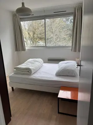 Un ou plusieurs lits dans un hébergement de l'établissement Appartement Super Besse