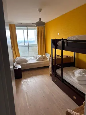 Un ou plusieurs lits dans un hébergement de l'établissement Appartement Super Besse