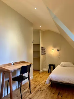 Un ou plusieurs lits dans un hébergement de l'établissement Gîte Le Four à Pain 6 personnes sur le domaine du Manoir du Rigouneix