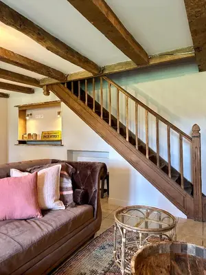 Coin salon dans l'établissement Gîte Le Four à Pain 6 personnes sur le domaine du Manoir du Rigouneix