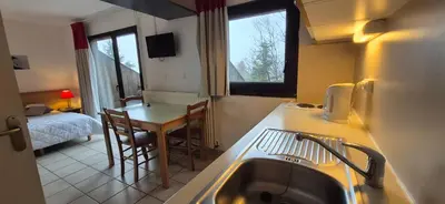 Un ou plusieurs lits dans un hébergement de l'établissement Village Montanha Lioran