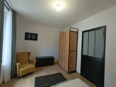 Coin salon dans l'établissement # Le Beffroi# Maison# Murol