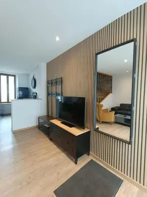 Télévision ou salle de divertissement dans l'établissement # Le Beffroi# Maison# Murol