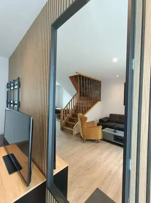 Télévision ou salle de divertissement dans l'établissement # Le Beffroi# Maison# Murol
