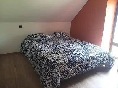 Un ou plusieurs lits dans un hébergement de l'établissement Gîte confortable à la campagne