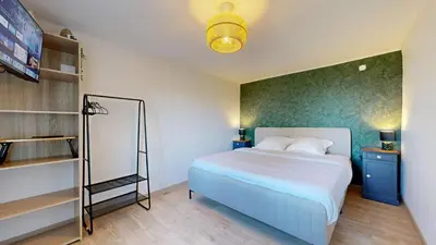Un ou plusieurs lits dans un hébergement de l'établissement Maison Avec Spa et Sauna Privé
