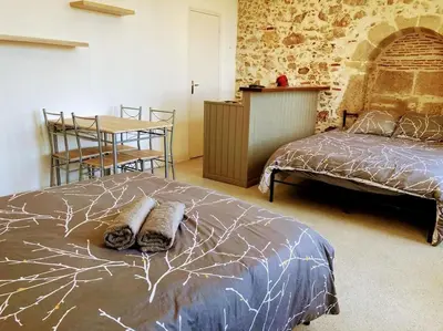 Un ou plusieurs lits dans un hébergement de l'établissement Appartement double dans le centre