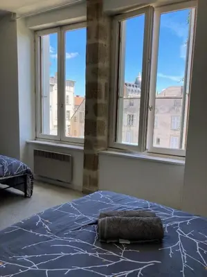 Un ou plusieurs lits dans un hébergement de l'établissement Appartement double dans le centre