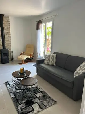 Coin salon dans l'établissement Maison avec piscine classée 3 étoiles