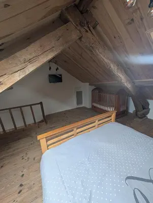 Un ou plusieurs lits dans un hébergement de l'établissement Maison agréable 4 à 6 pers