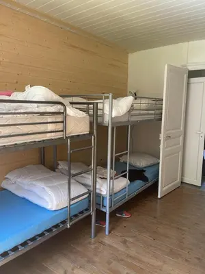 Un ou plusieurs lits dans un hébergement de l'établissement Appartement pour 8 personnes