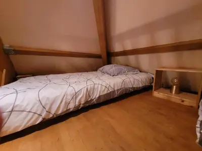 Un ou plusieurs lits dans un hébergement de l'établissement Gîte Les B