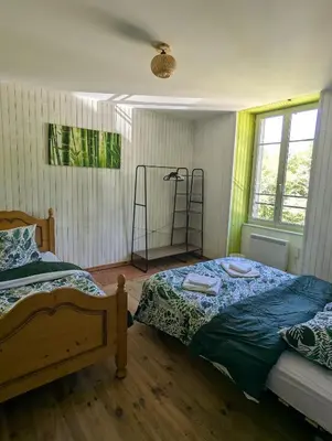Un ou plusieurs lits dans un hébergement de l'établissement Ferme Équestre Equi'Cantal