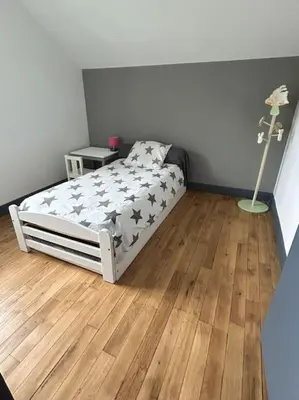 Un ou plusieurs lits dans un hébergement de l'établissement Maison le Ragean
