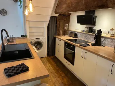 Cuisine ou kitchenette dans l'établissement Maison de charme 7 personnes