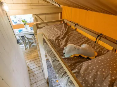 Un ou plusieurs lits dans un hébergement de l'établissement Camping Saint-Sozy