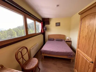 Un ou plusieurs lits dans un hébergement de l'établissement Charmant T2 cabine au pied des pistes - 4 pers - FR-1-787-32