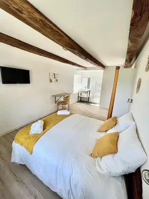 Un ou plusieurs lits dans un hébergement de l'établissement Gîte D'Ozange