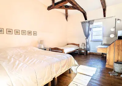 Un ou plusieurs lits dans un hébergement de l'établissement 20 min Lioran, Maison familiale en Auvergne, Nature et Confort,