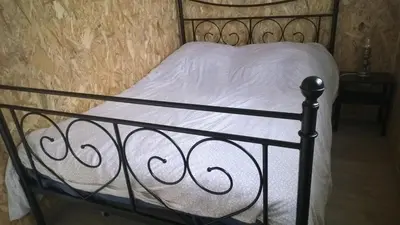 Un ou plusieurs lits dans un hébergement de l'établissement Chalet Le Breuil