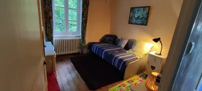 Un ou plusieurs lits dans un hébergement de l'établissement Superbe maison de maître