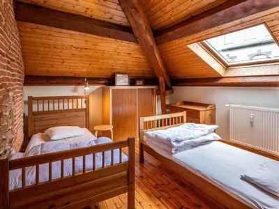 Un ou plusieurs lits dans un hébergement de l'établissement Appartement duplex le montagne de la villa Chanterive
