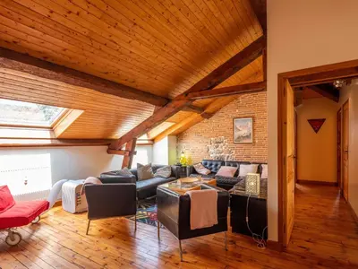 Coin salon dans l'établissement Appartement duplex le montagne de la villa Chanterive