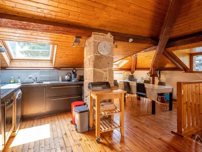 Cuisine ou kitchenette dans l'établissement Appartement duplex le montagne de la villa Chanterive