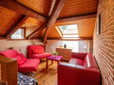 Coin salon dans l'établissement Appartement duplex le montagne de la villa Chanterive