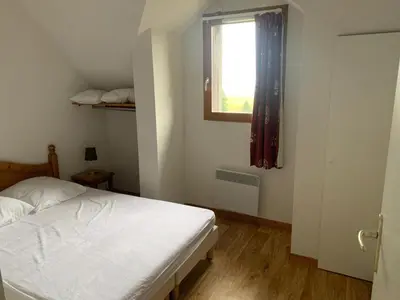 Un ou plusieurs lits dans un hébergement de l'établissement Appartement dans Résidence Bois de la Reine, Besse et Saint Anastaise
