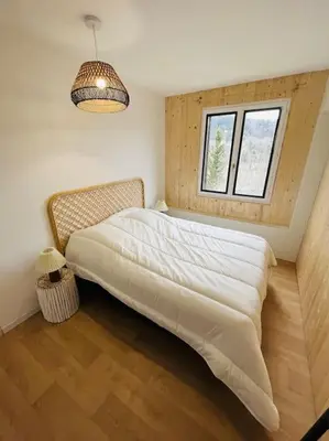 Un ou plusieurs lits dans un hébergement de l'établissement Appartement Le Romy Vue Montagne