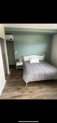 Un ou plusieurs lits dans un hébergement de l'établissement Appartement avec un agréable point de vue et quartier calme