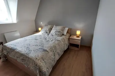 Un ou plusieurs lits dans un hébergement de l'établissement Gite pour 6 personnes à 15 min dAurillac Cantal