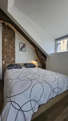 Un ou plusieurs lits dans un hébergement de l'établissement Maison Saint Surin, Climatisation-Cosy