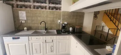 Cuisine ou kitchenette dans l'établissement Maison de village
