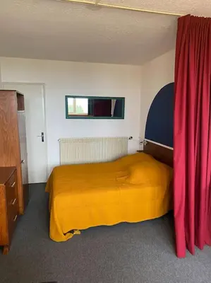 Un ou plusieurs lits dans un hébergement de l'établissement Appartement à la montagne