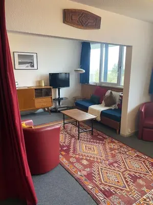 Télévision ou salle de divertissement dans l'établissement Appartement à la montagne