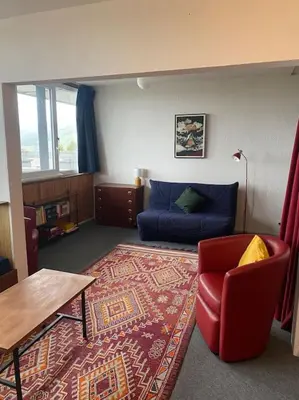 Coin salon dans l'établissement Appartement à la montagne