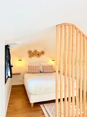 Un ou plusieurs lits dans un hébergement de l'établissement La Chambrote - Maison cosy avec spa privatif