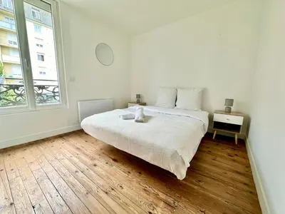 Un ou plusieurs lits dans un hébergement de l'établissement L'Omega, lumineux & cosy