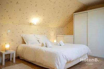 Un ou plusieurs lits dans un hébergement de l'établissement Green Oasis 5-Room Apartment with Large Garden
