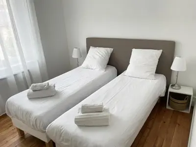 Un ou plusieurs lits dans un hébergement de l'établissement Appartement Louison jusqu'à 4 personnes