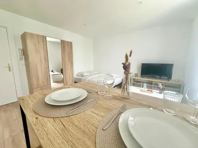 Télévision ou salle de divertissement dans l'établissement Le Gamma, cosy et lumineux