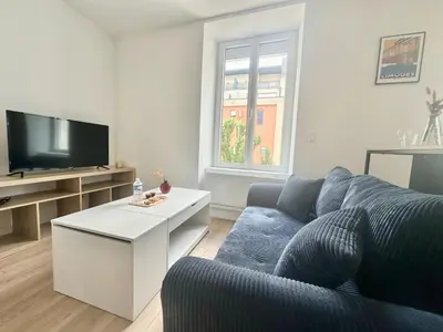 Télévision ou salle de divertissement dans l'établissement Le Gamma, cosy et lumineux