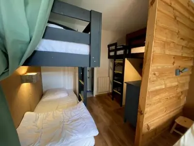Un ou plusieurs lits dans un hébergement de l'établissement Appartement duplex avec vue sur le Sancy et garage couvert